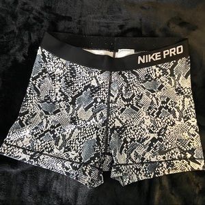 Black snake print Nike pro shorts.